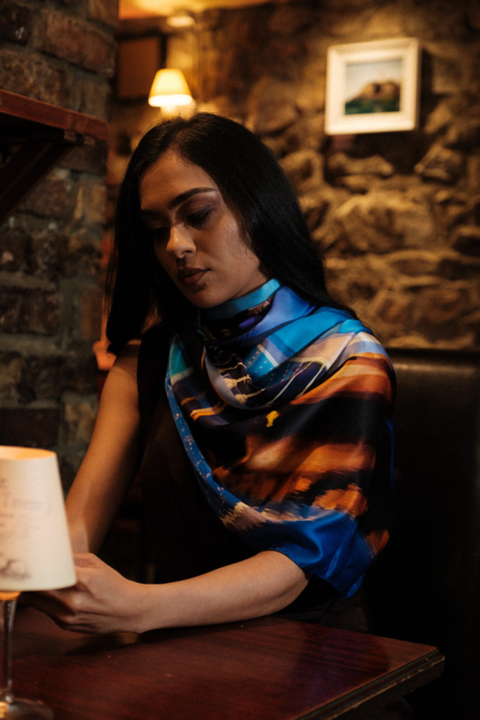 Woman sitting at a table looking pensive