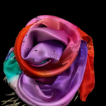 orange purple silk scarf on black background