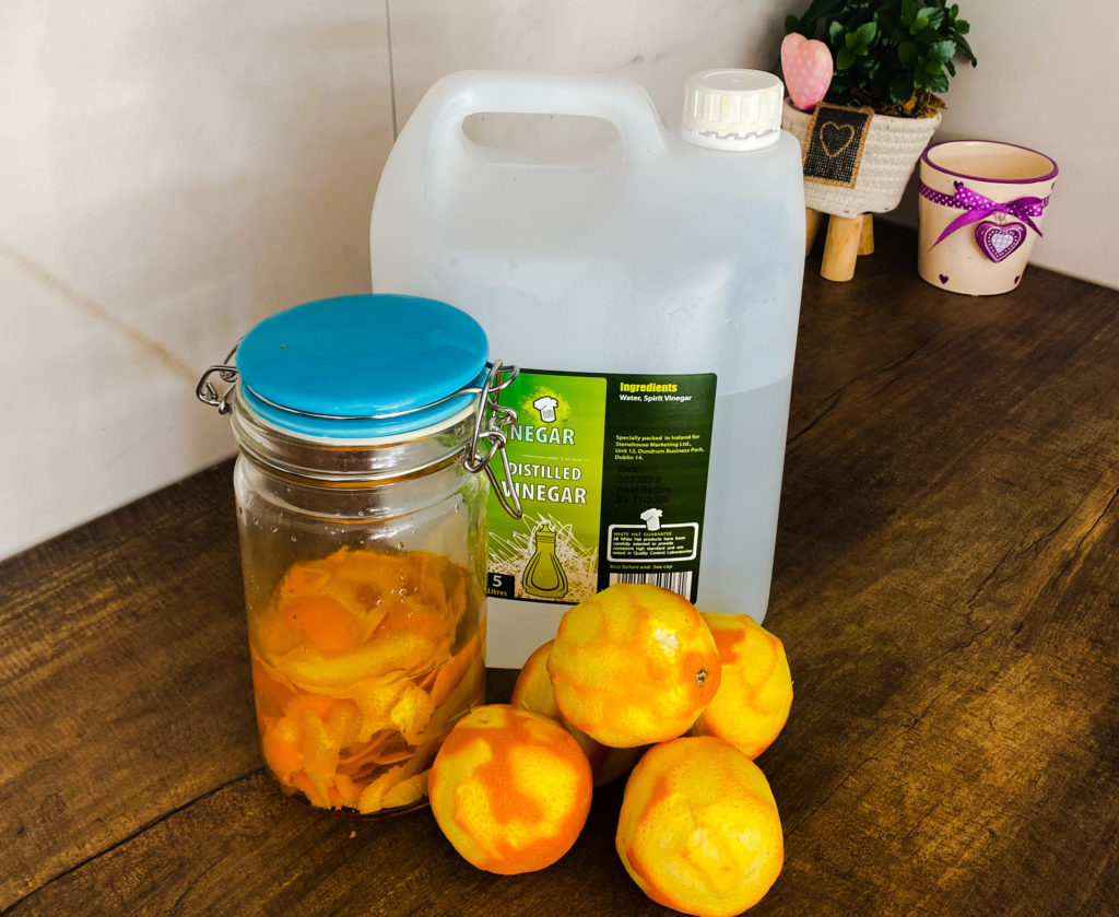 eco-friendly cleaner with orange peels and vinegar