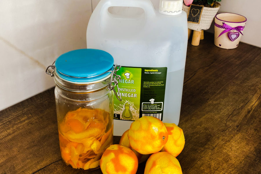 eco-friendly cleaner with orange peels and vinegar